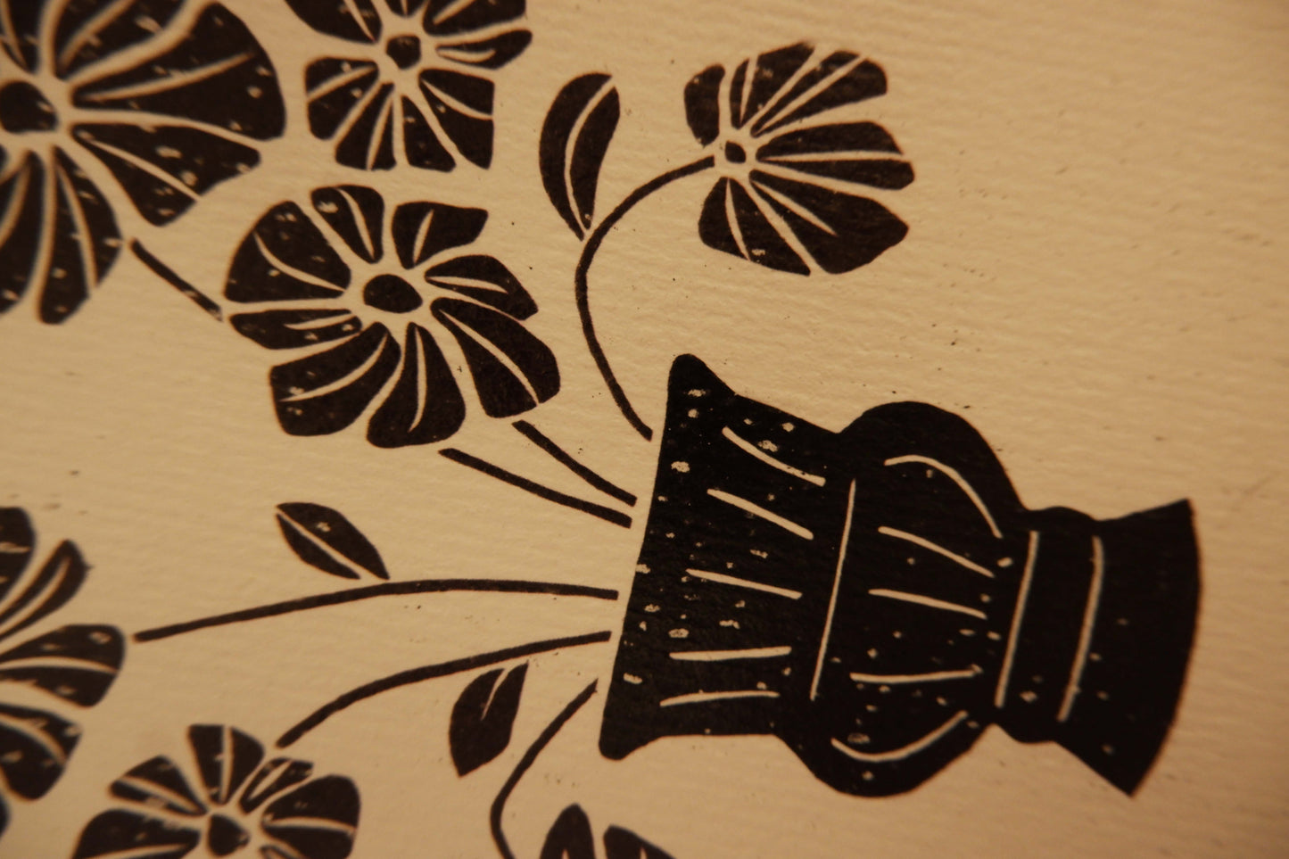 Black floral design on beige paper