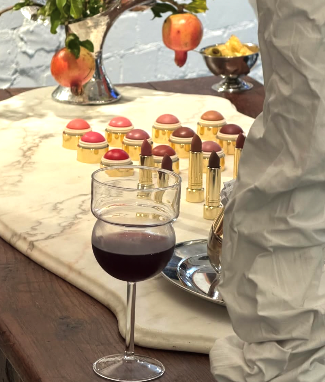 Marble surface with a glass of red wine.