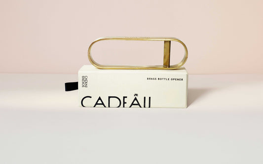 Brass bottle opener on box 