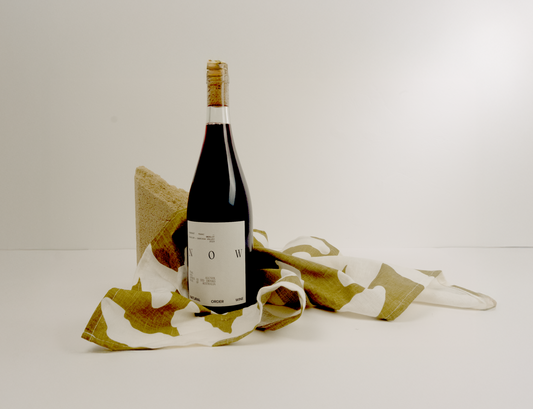 Wine bottle and linen towel set plain background