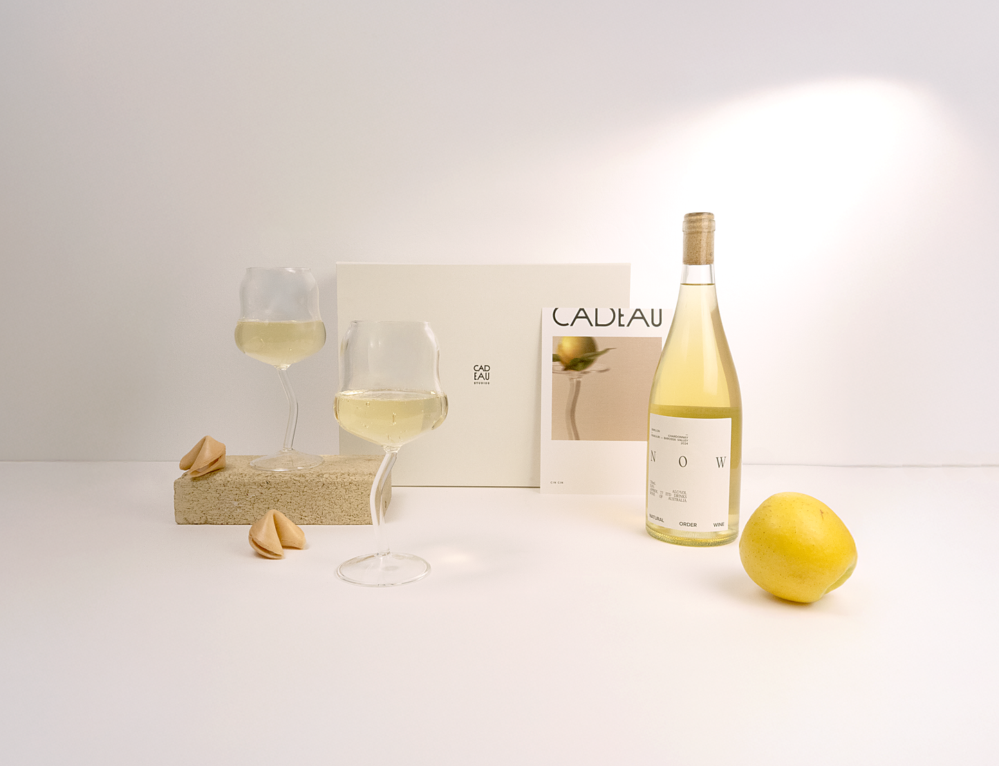 Wine bottle, glasses, fortune cookies in gift box