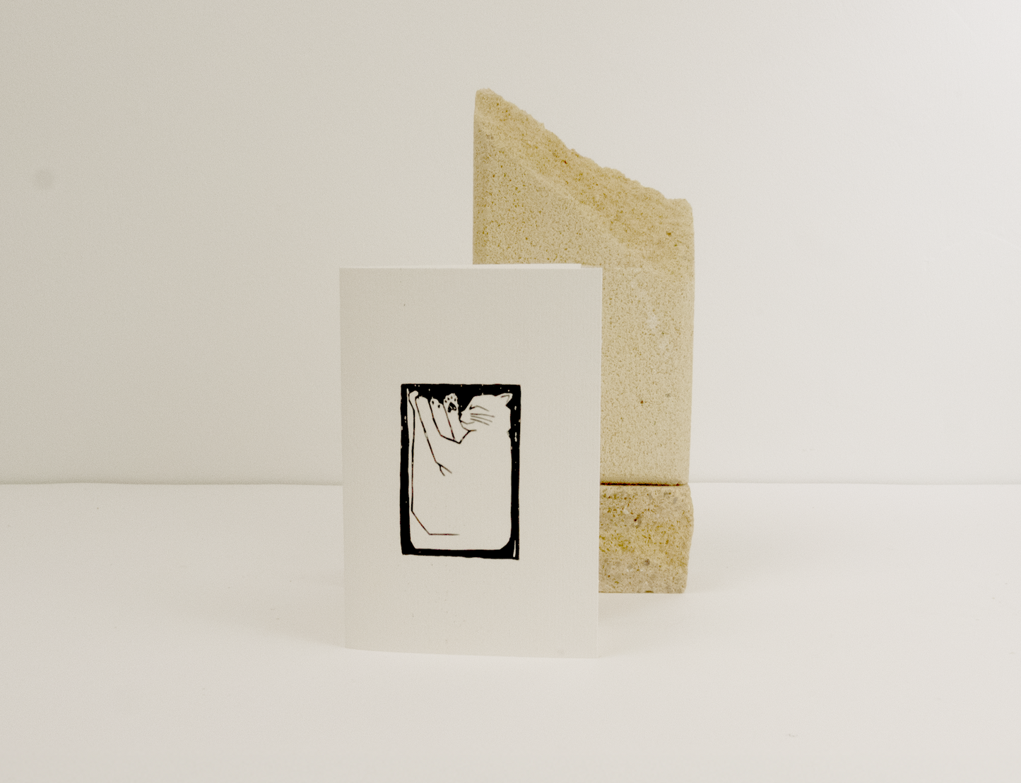 Lino print greeting card of cat sleeping 