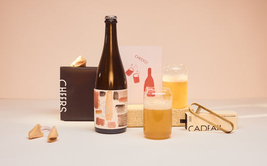 Cheers beer kit contents including glass beer can and brass bottle opener 