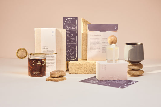 Self care box contents. Candle, bath salts, organic energising ginger tea, brass tea strainer, journal